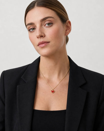 British model wearing the Estelle gold red enamel heart necklace