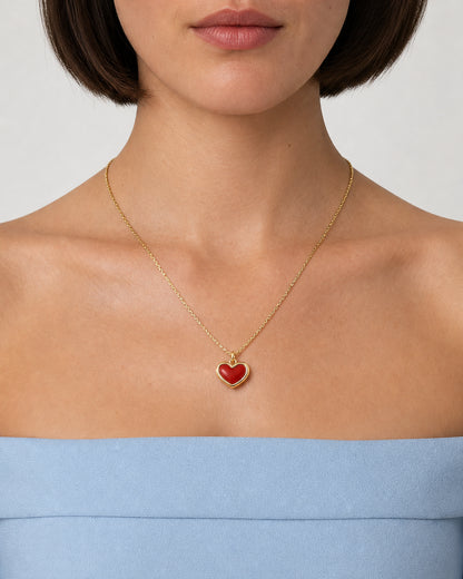 Frontal mouth-down wearing view of the Estelle red enamel heart necklace