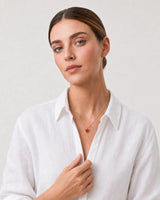 Human-scale Riviera styling portrait of the Estelle heart necklace