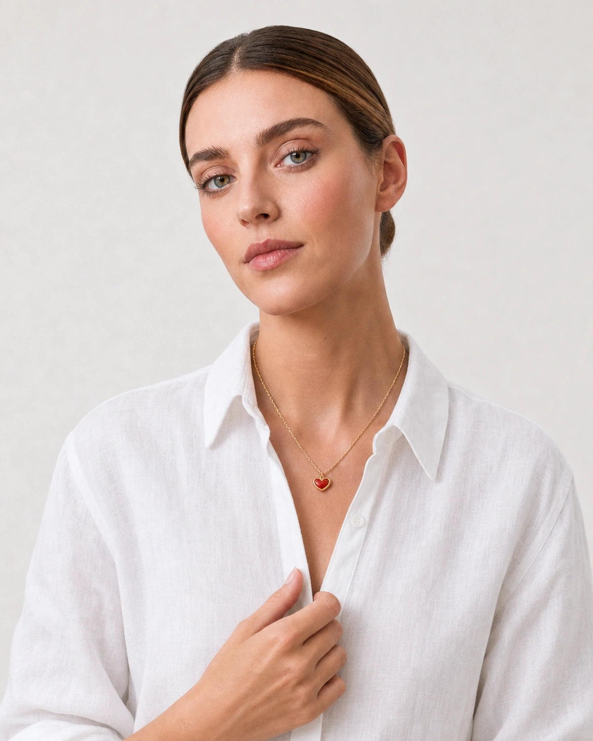 Human-scale Riviera styling portrait of the Estelle heart necklace