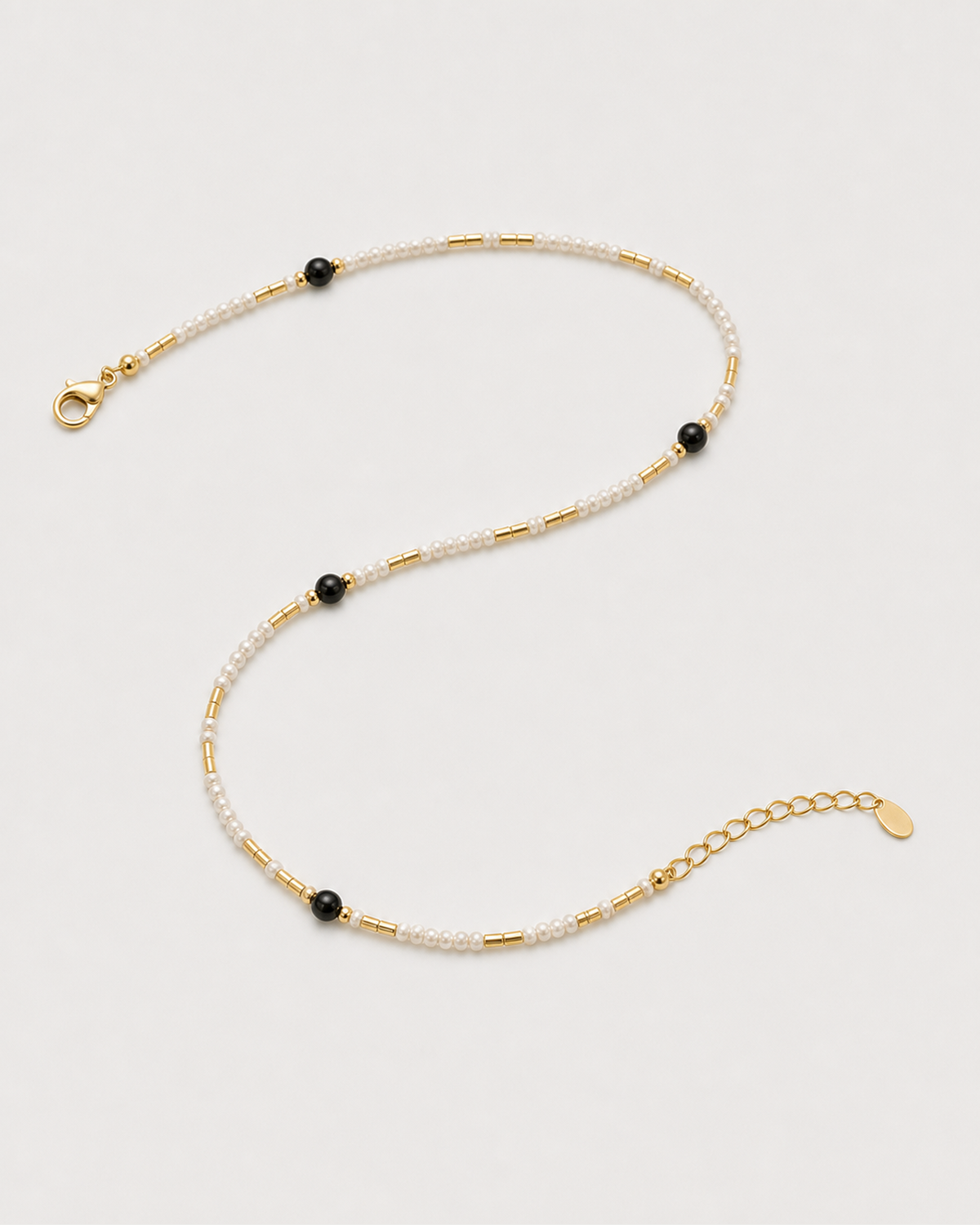 Open construction view of Isla choker with lobster clasp, extender chain and oval tag