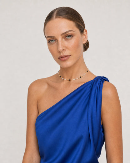 Alternate cobalt silk portrait featuring the Isla ivory black and gold choker