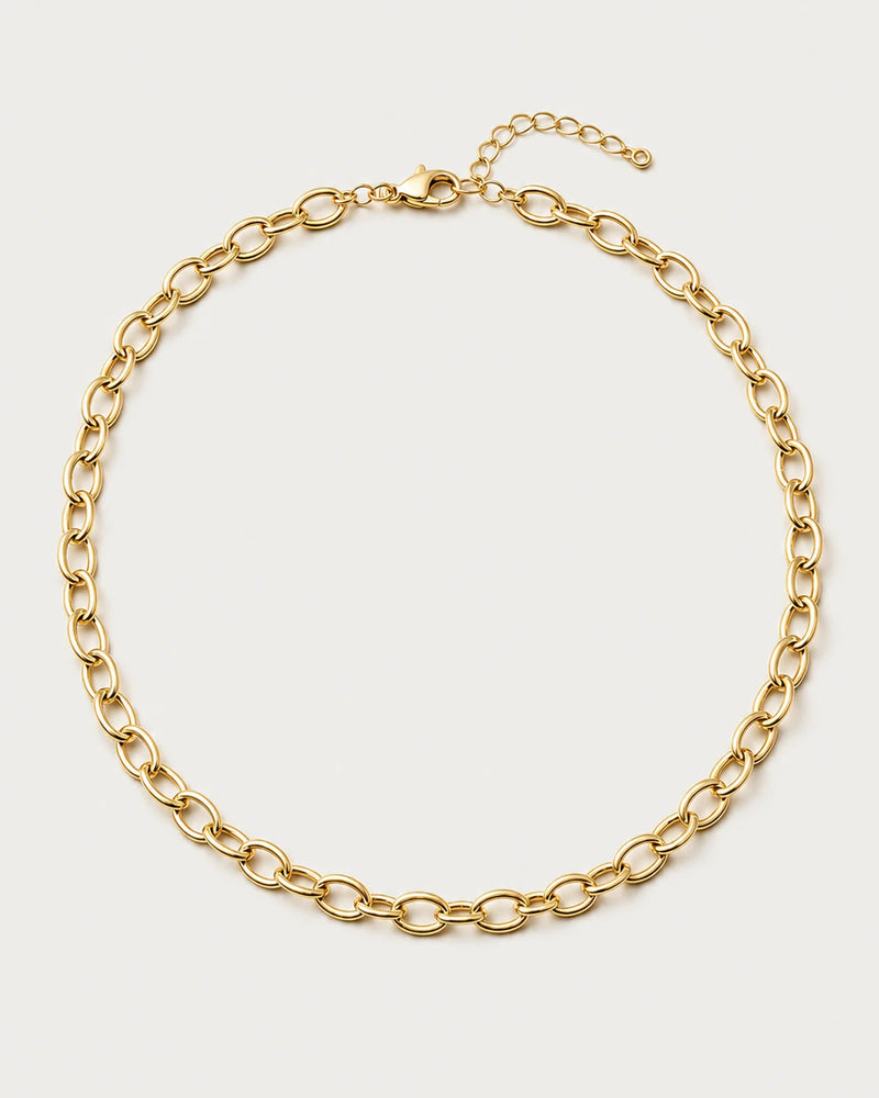 Liora gold orbit-link chain necklace on a seamless pale dove-grey background