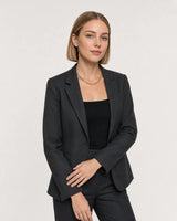 Wider studio portrait showing the Liora orbit chain at natural collar scale