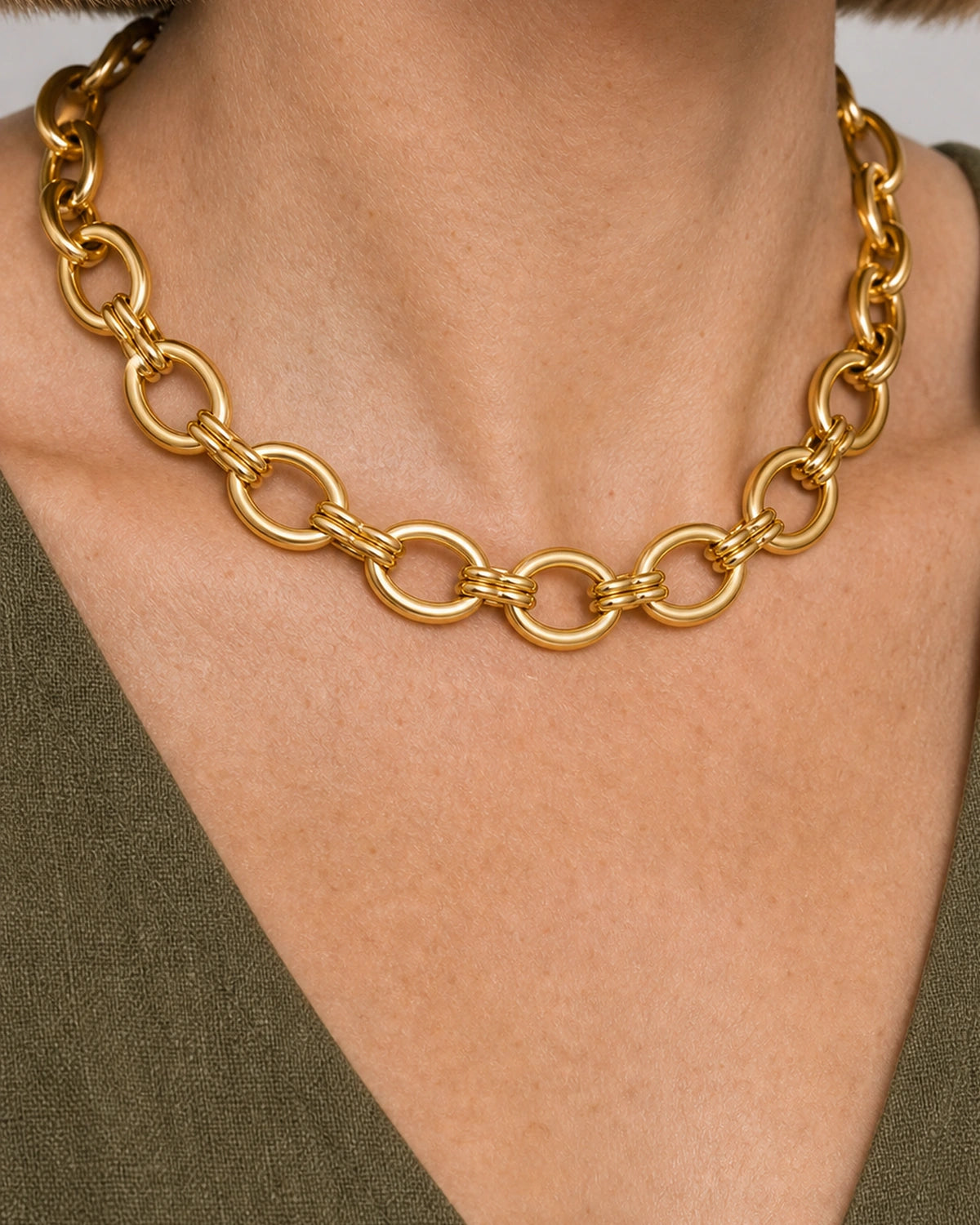 On-body macro of Liora's open oval links and paired connector loops