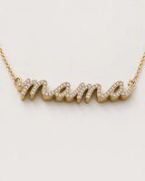 Macro of the Liora lowercase pavé mama script and raised polished gold sidewall