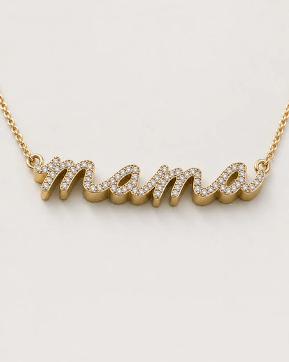 Macro of the Liora lowercase pavé mama script and raised polished gold sidewall