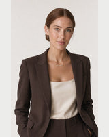Australian model aged 26 to 29 wearing the Liora sculpted mama necklace