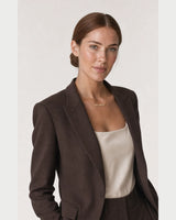 Alternate portrait of the same Australian model wearing the Liora necklace