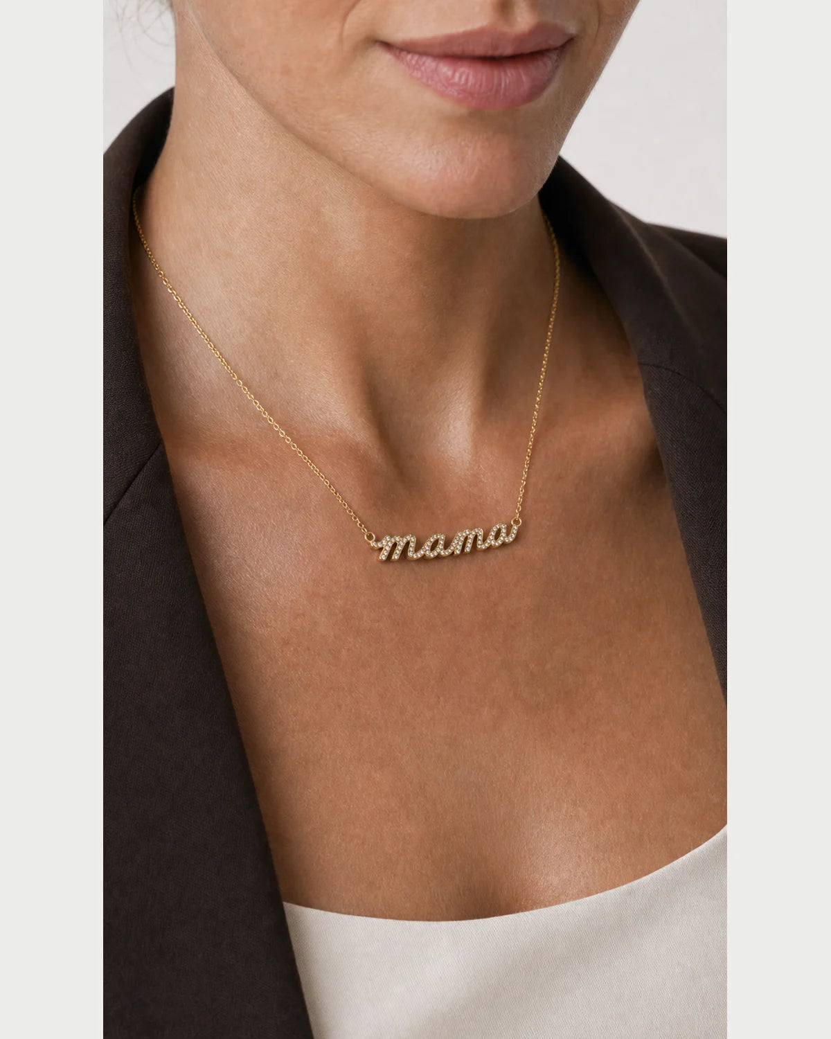 Extreme on-body macro of the Liora pavé mama script and raised gold sidewall
