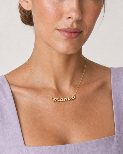 Close neckline view of the Liora pave mama script and sculpted gold edge