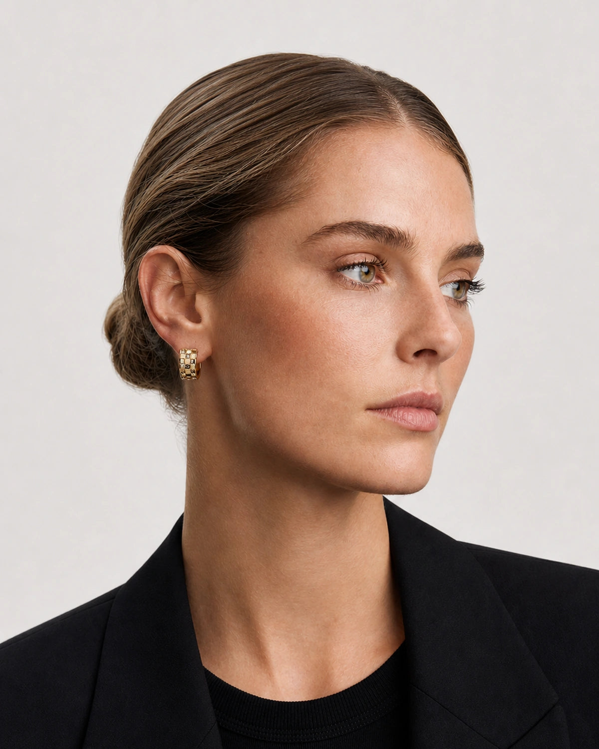 Alternate portrait of the same British model wearing Lisette huggies