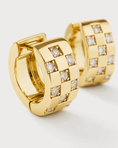Macro of the gold Lisette three-column checkerboard and square zircon settings