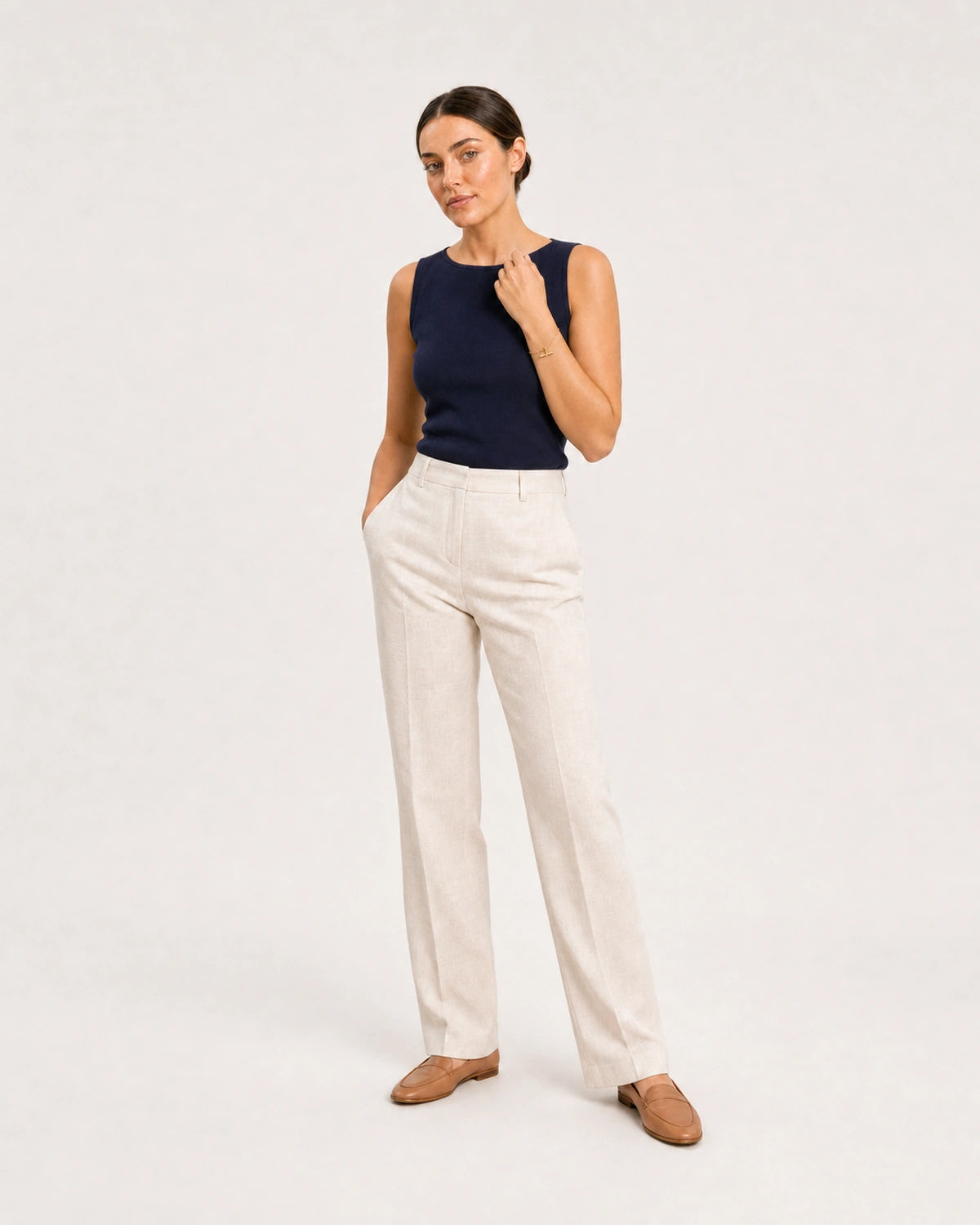 Wide studio portrait in navy and cream linen featuring the Lucille bracelet