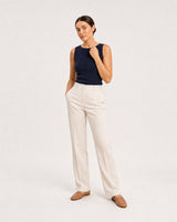 Wide studio portrait in navy and cream linen featuring the Lucille bracelet