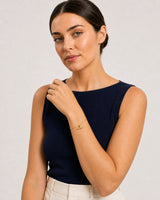 Human-scale Riviera styling portrait of the Lucille gold bracelet