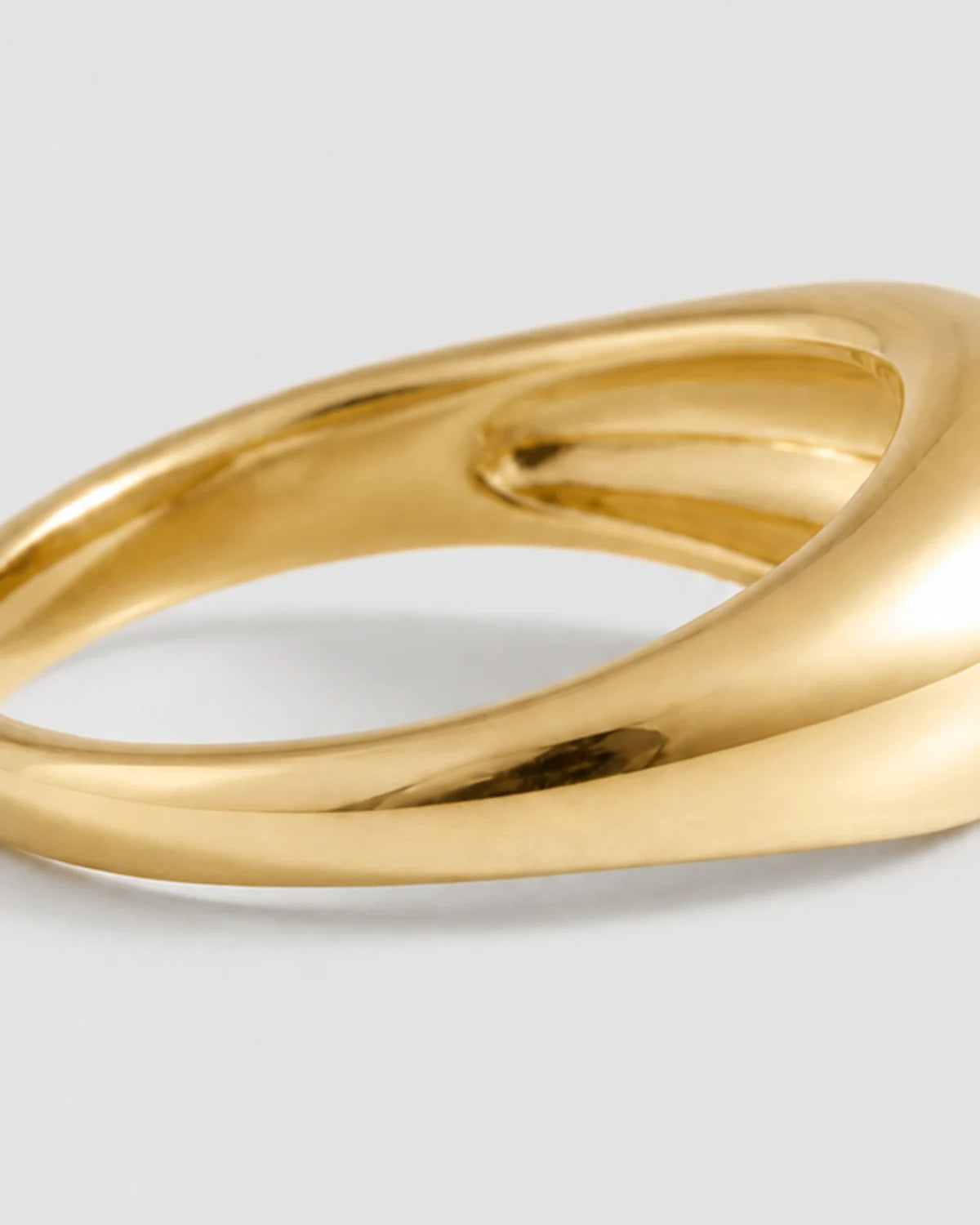 Macro detail of the Lune ring's broad rounded dome and tapered shank