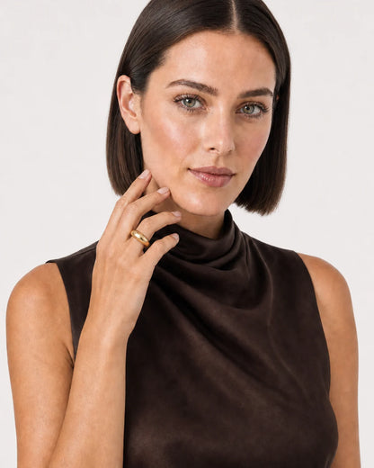 Australian model aged 25 to 28 wearing the Lune dome ring in a pale dove-grey studio