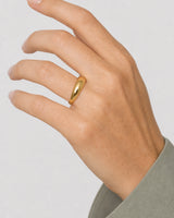 Complete worn macro of the Lune gold dome ring at true human scale