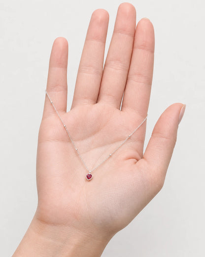 Hand-held scale view of the Maëlle silver station necklace