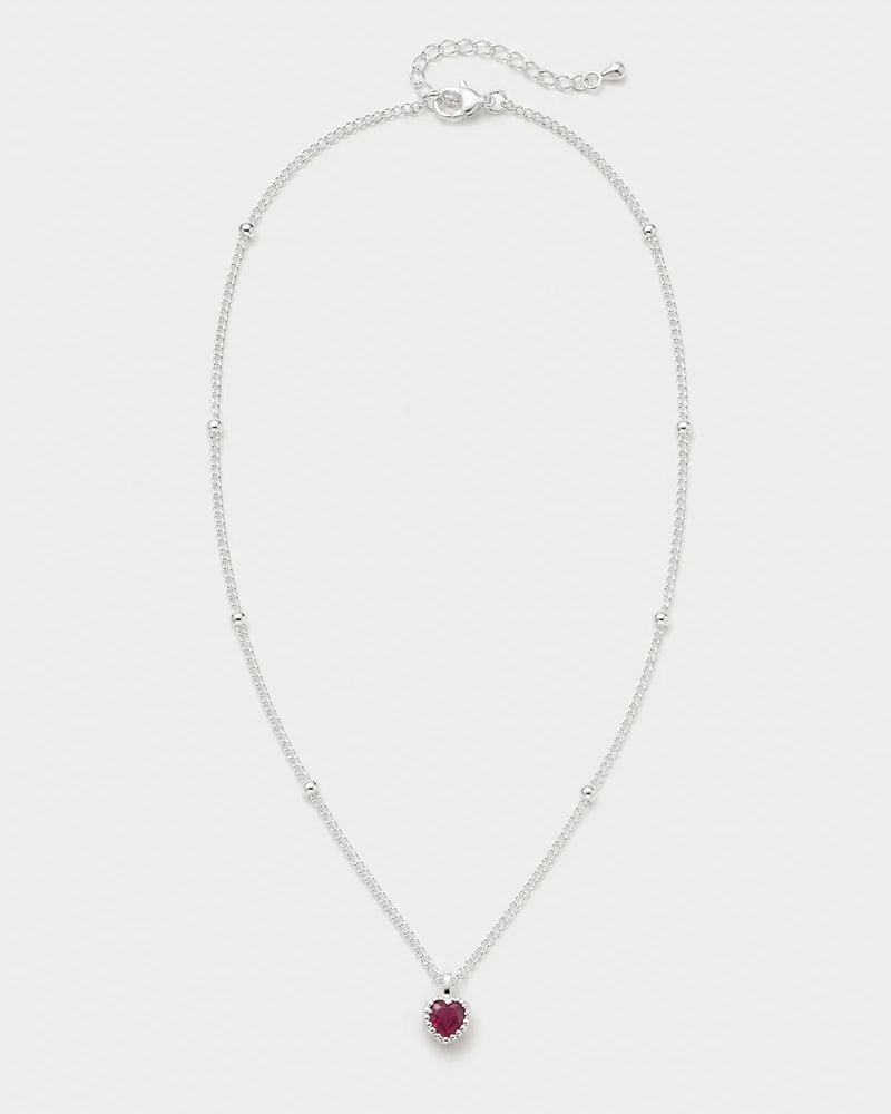 Maëlle silver crimson heart station necklace on seamless pale neutral grey