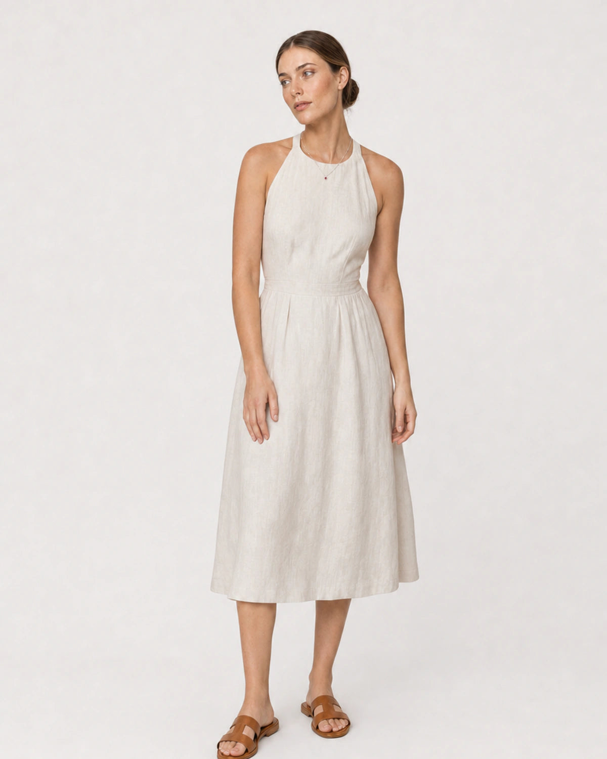 Full-body ivory linen portrait featuring the Maëlle crimson heart necklace