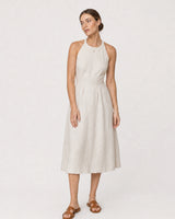 Full-body ivory linen portrait featuring the Maëlle crimson heart necklace