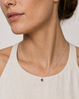 Close wearing view of the Maëlle silver station chain and crimson heart