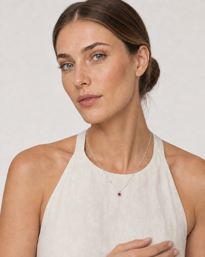 Human-scale portrait showing the delicate Maëlle crimson heart pendant