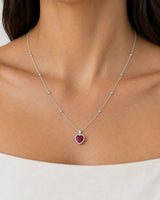 Complete worn macro of the Maëlle crimson heart station necklace at natural scale