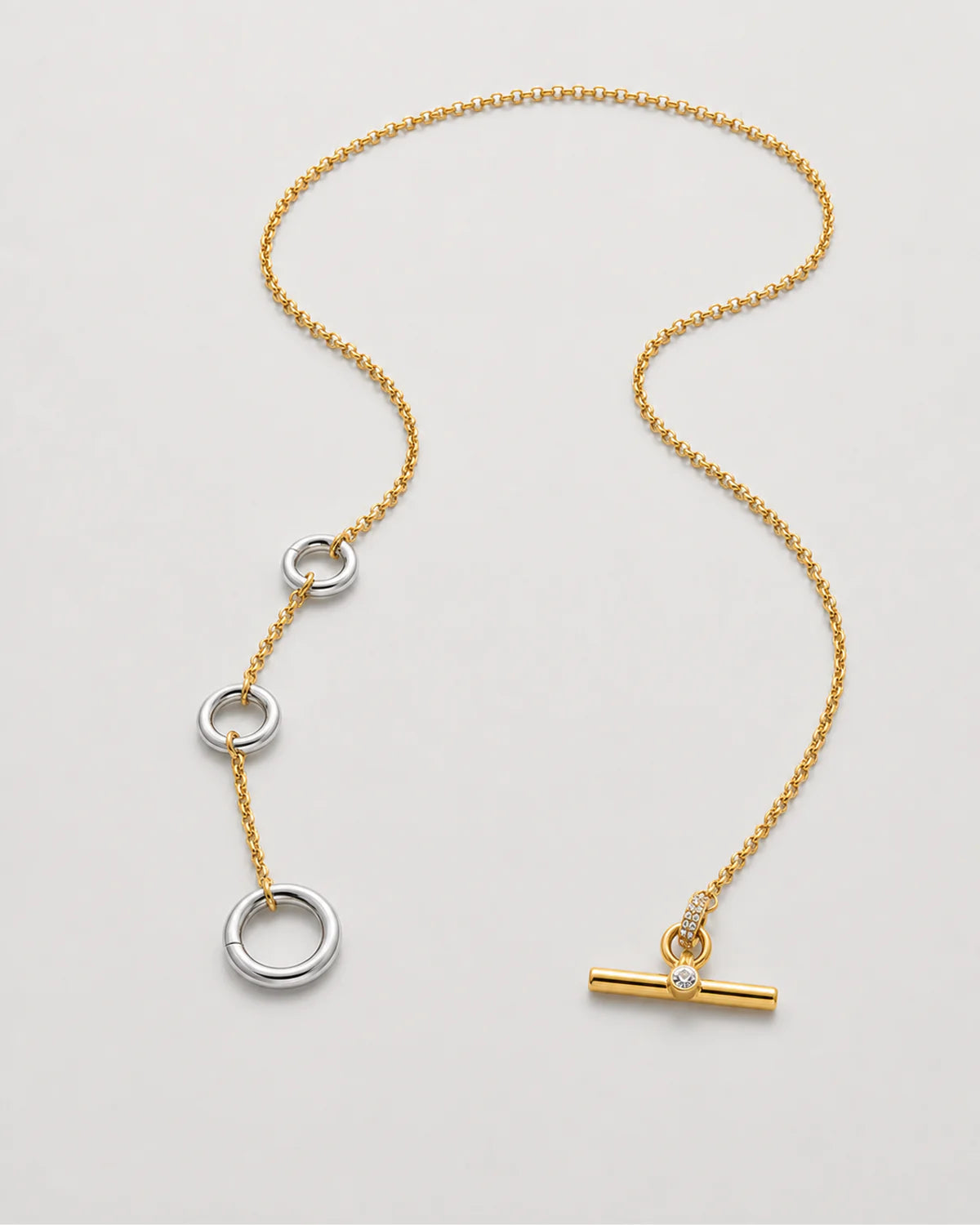 Marais mixed-metal lariat shown unfastened in an alternate studio arrangement