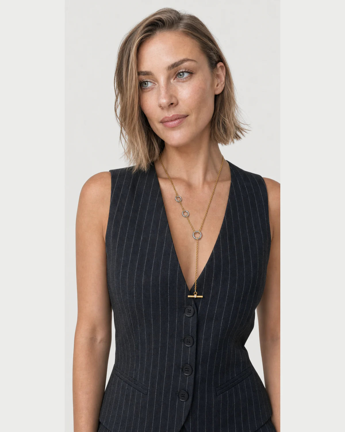 Three-quarter studio portrait featuring the Marais lariat necklace