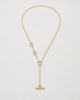 Marais mixed-metal crystal lariat necklace on seamless pale neutral grey