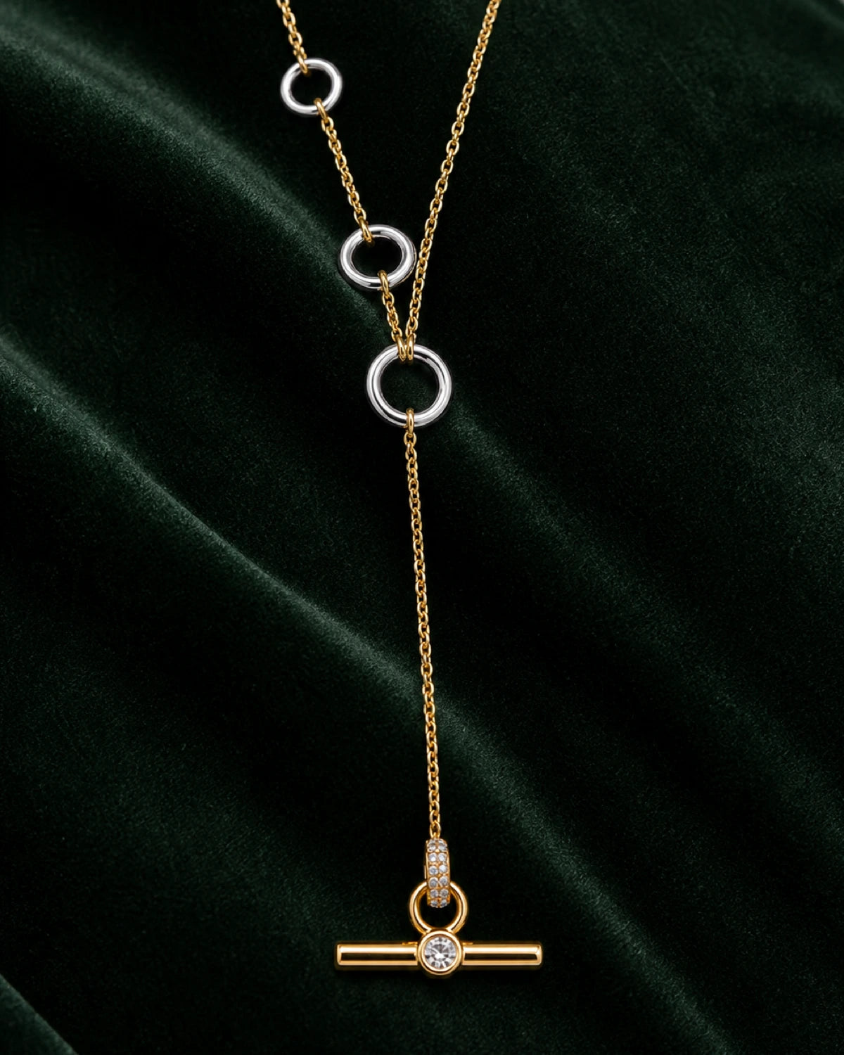 Complete worn macro of the Marais three silver rings, long drop and crystal T-bar