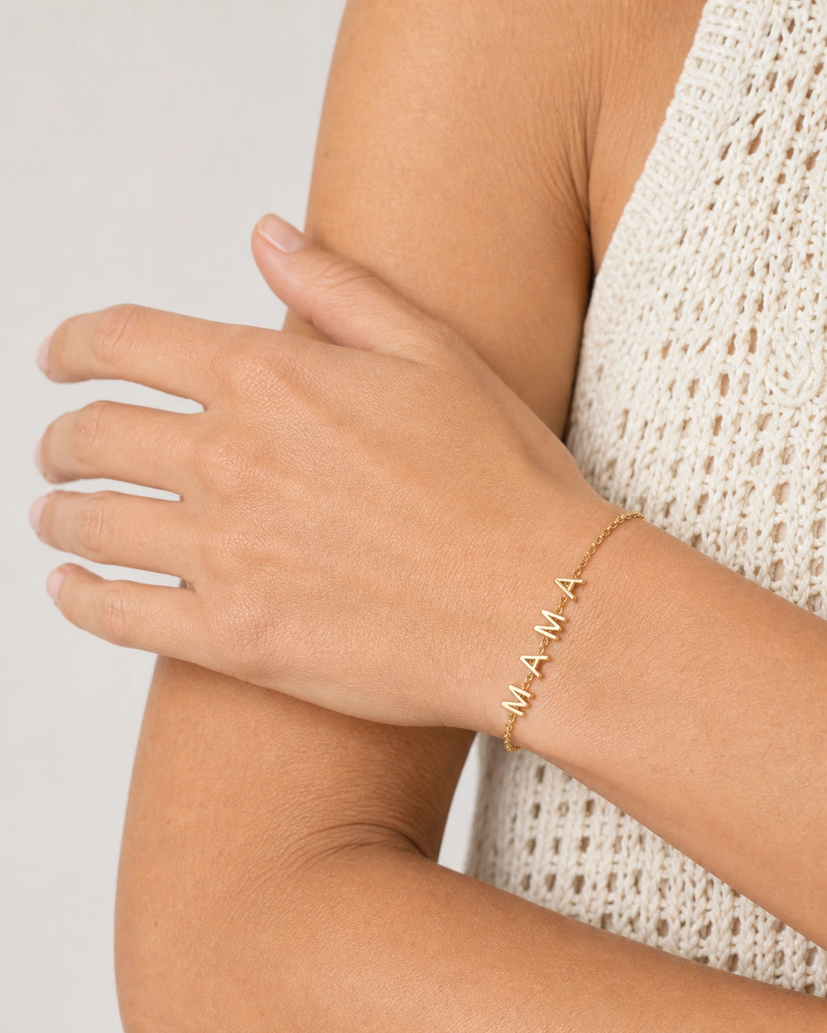 Close wrist view of the Maren bracelet with four separate M A M A charms