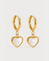 Pair of Maris gold mother-of-pearl heart huggies on a seamless pale dove-grey background