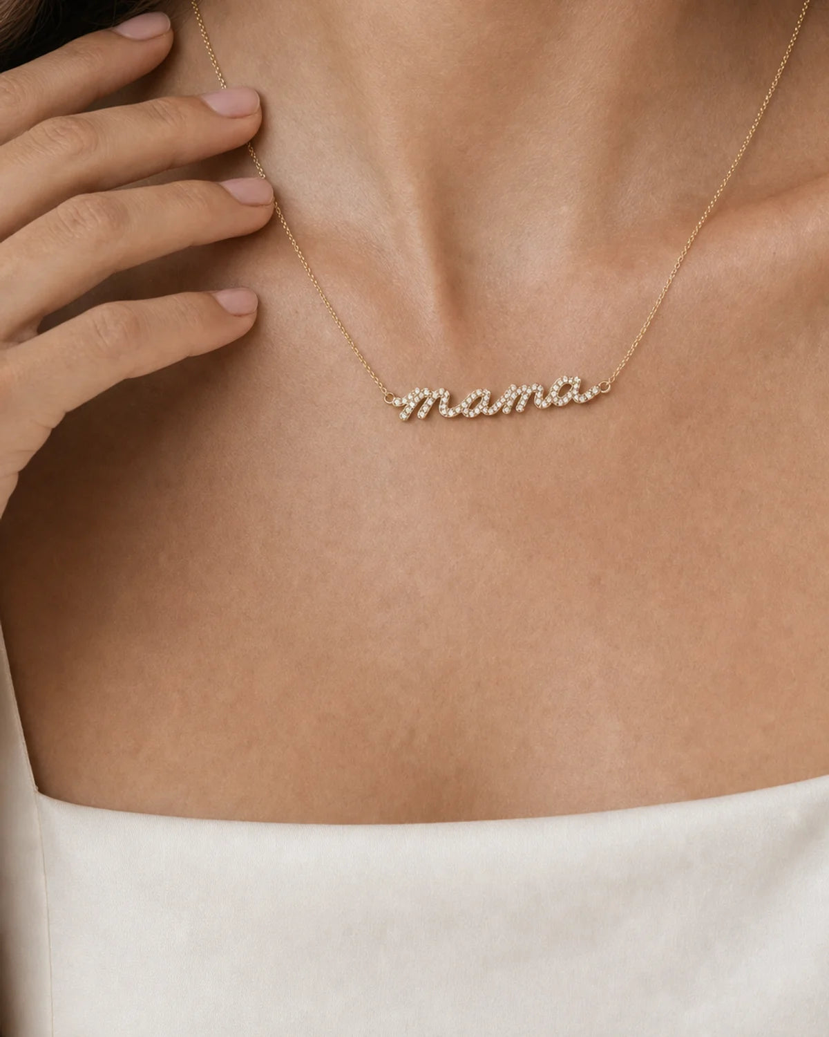 Human-scale wearing detail of the Mila pave mama necklace