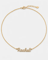 Mira gold pavé Rachel name necklace on pale dove-grey