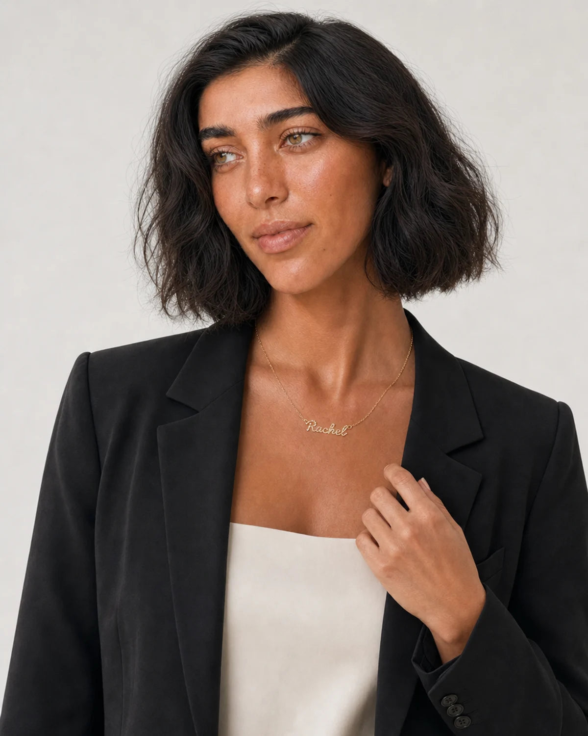 Alternate portrait of the same model wearing the Mira Rachel necklace