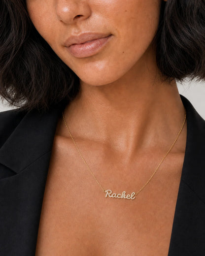 Close neckline view of the Mira pavé Rachel nameplate
