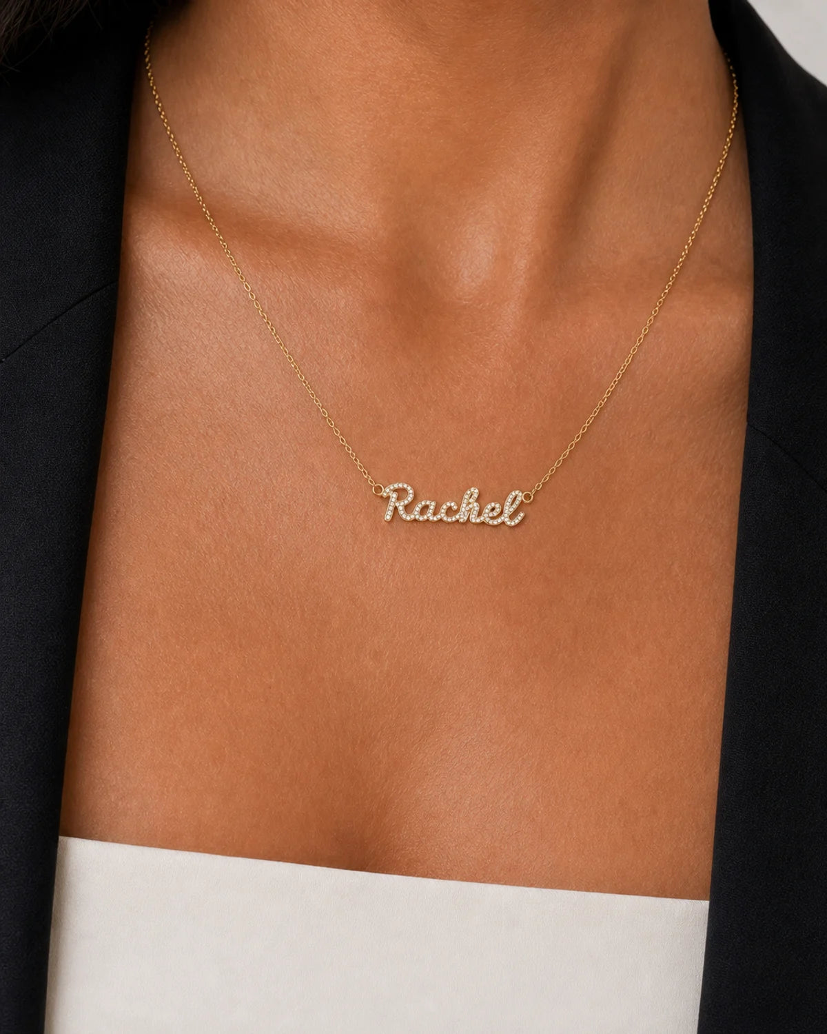 Extreme on-body macro of the Mira Rachel nameplate and side loops