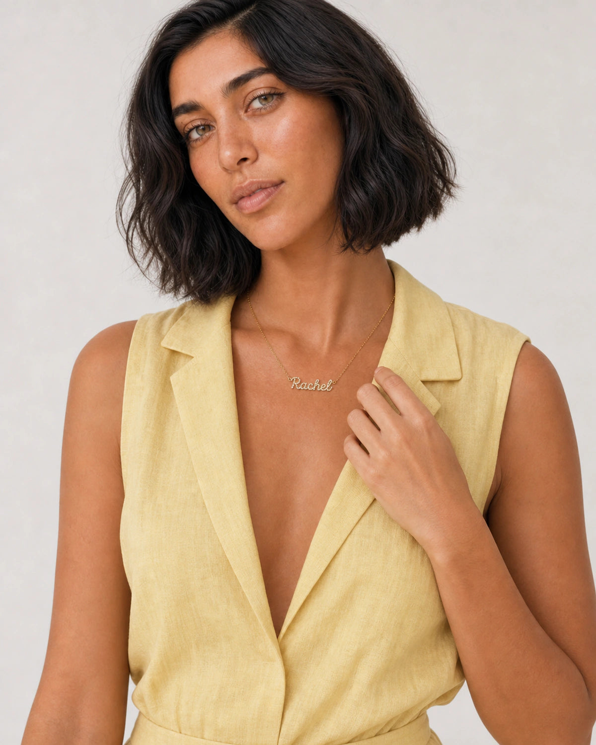Alternate European-summer portrait featuring the Mira pave name necklace