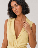 Human-scale summer portrait showing the Mira Rachel name necklace