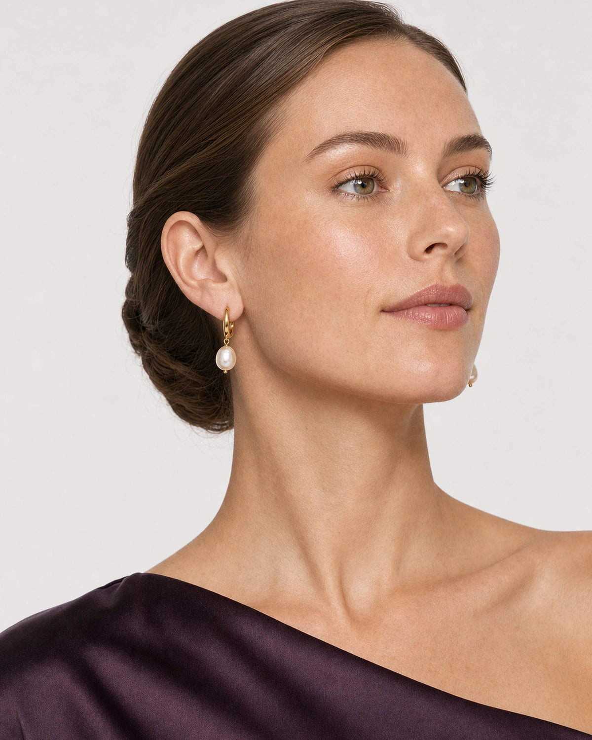 Alternate profile portrait wearing the Mirelle gold and pearl earrings