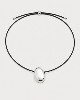 Naiya silver pebble cord necklace on a seamless pale dove-grey studio background