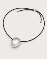 Reverse view of the Naiya concave silver pebble, braided cord, slider and end caps