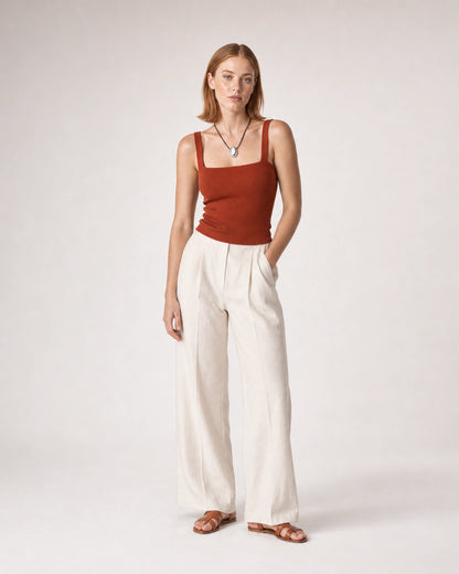 Wide studio portrait in terracotta knit and ivory linen featuring the Naiya necklace