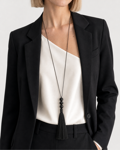 Close wearing view of the Nera three black beads and complete fringe tassel