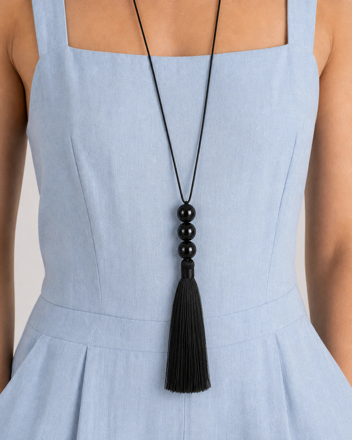Extreme on-body macro of the Nera three-bead stack and full fibre tassel