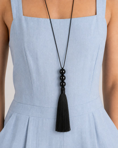 Extreme on-body macro of the Nera three-bead stack and full fibre tassel